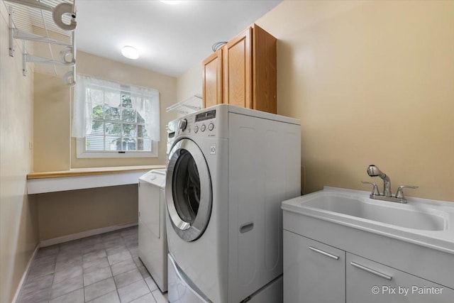 631 Alice Ct, Elgin, IL 60123 - clothes washing area featuring cabinet space, washing machine and clothes dryer, baseboards, and light tile patterned floors