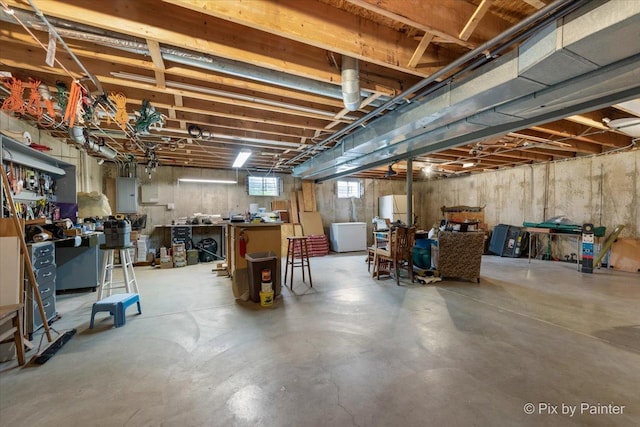 631 Alice Ct, Elgin, IL 60123 - below grade area featuring electric panel, washer / clothes dryer, and a workshop area