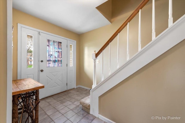 631 Alice Ct, Elgin, IL 60123 - foyer with stairway, baseboards, and light tile patterned floors