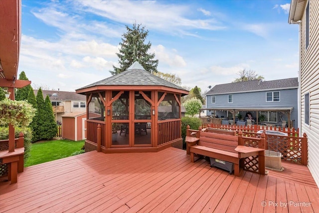 631 Alice Ct, Elgin, IL 60123 - deck featuring a gazebo, a storage unit, and an outbuilding