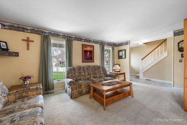 631 Alice Ct, Elgin, IL 60123 - carpeted living room with stairs and baseboards