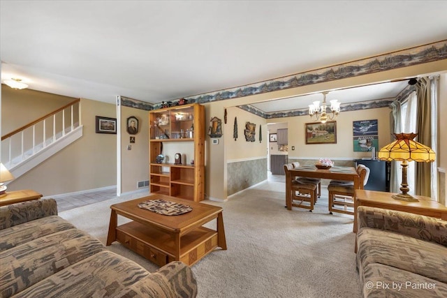 631 Alice Ct, Elgin, IL 60123 - living area featuring light carpet, a chandelier, stairs, and baseboards