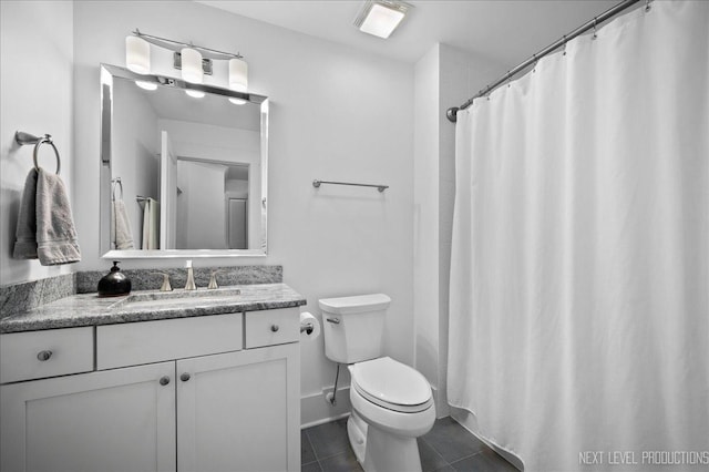 full bathroom featuring vanity, toilet, and tile patterned floors