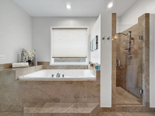 full bathroom with recessed lighting, a garden tub, and a shower stall