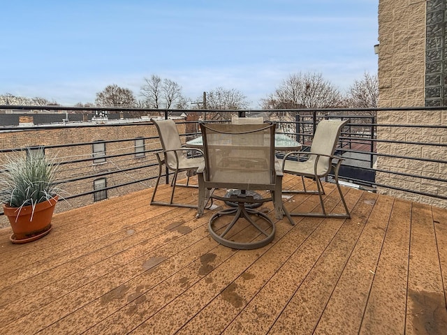 deck featuring outdoor dining area