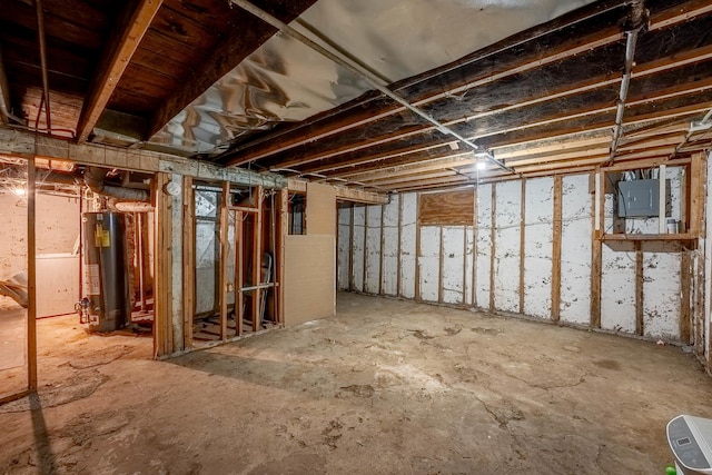 unfinished basement with gas water heater and electric panel