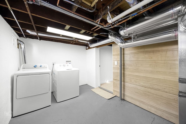 laundry area with laundry area and separate washer and dryer