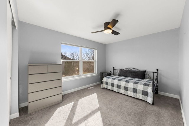 bedroom featuring baseboards, carpet floors, and ceiling fan