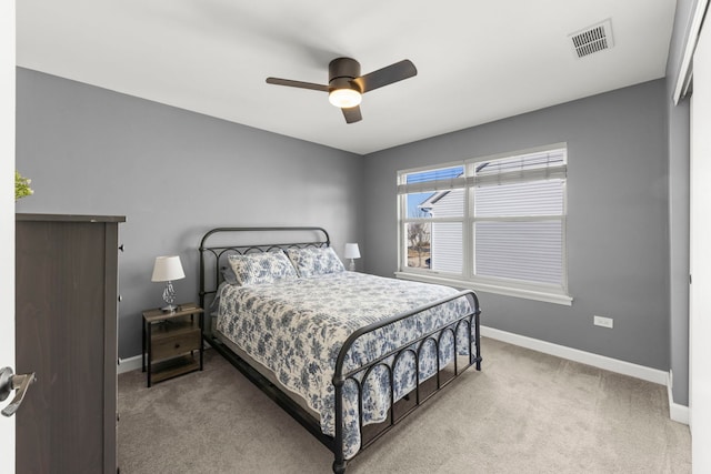 bedroom featuring visible vents, carpet flooring, baseboards, and ceiling fan