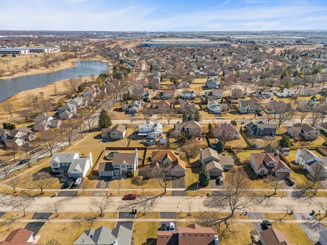 birds eye view of property with a residential view and a water view