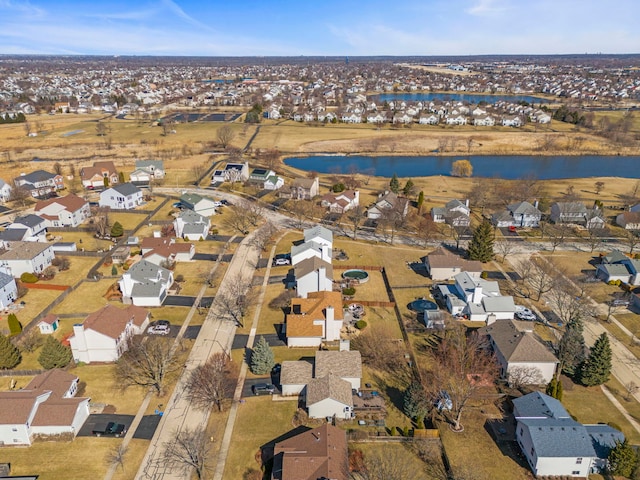 drone / aerial view with a water view and a residential view