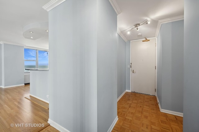 corridor featuring baseboards and ornamental molding