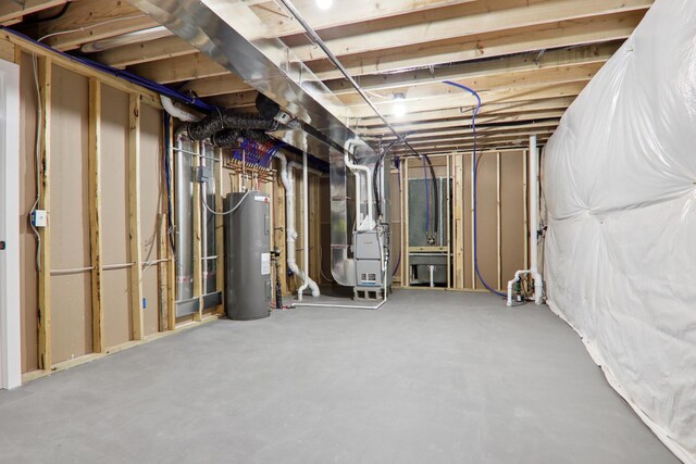 unfinished below grade area with heating unit and water heater