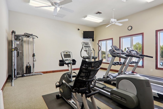 workout area featuring carpet floors, visible vents, ceiling fan, and baseboards