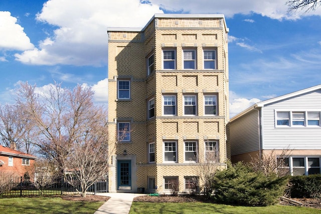 view of building exterior featuring fence