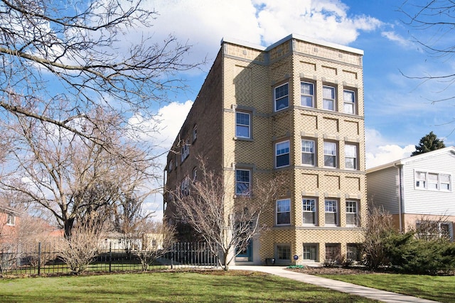 view of building exterior featuring fence