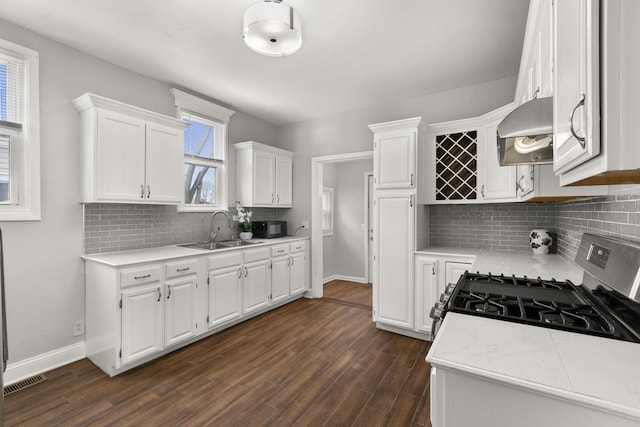 kitchen featuring light countertops and white cabinetry