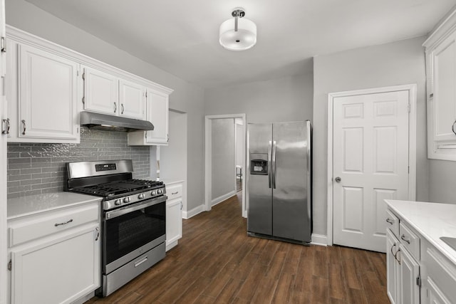 kitchen featuring under cabinet range hood, stainless steel appliances, dark wood-style flooring, white cabinets, and light countertops