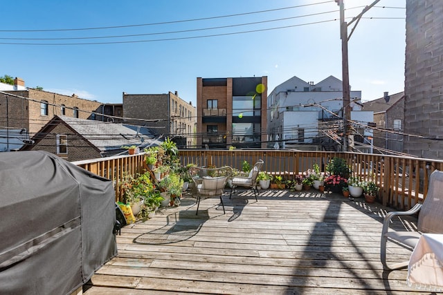 wooden deck featuring grilling area