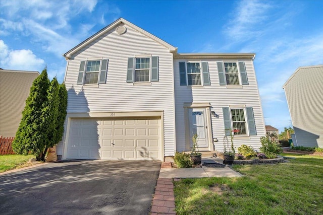 view of front of property featuring driveway, a front lawn, and an attached garage