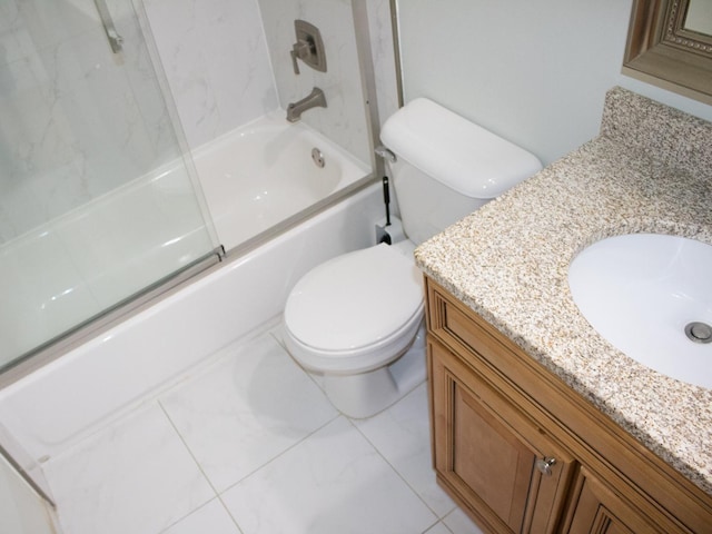 bathroom with enclosed tub / shower combo, vanity, and toilet