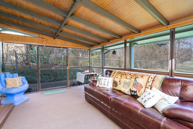 sunroom with vaulted ceiling with beams