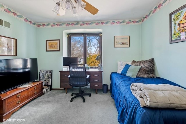 carpeted bedroom with visible vents and a ceiling fan