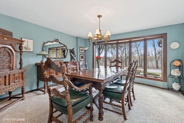 dining space featuring light carpet, baseboards, and a notable chandelier