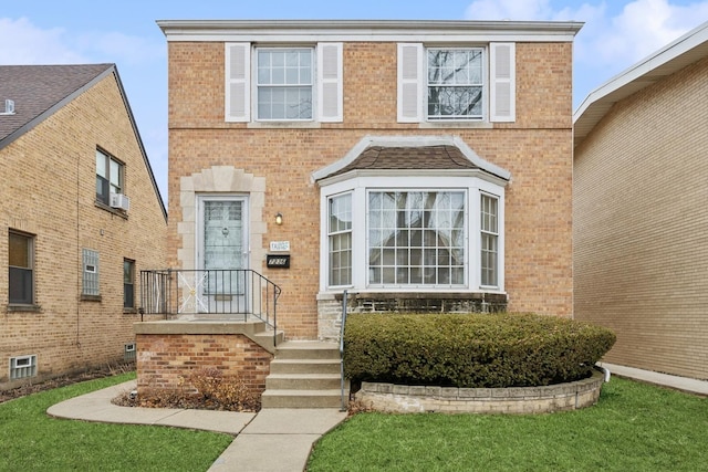 view of front of property featuring brick siding