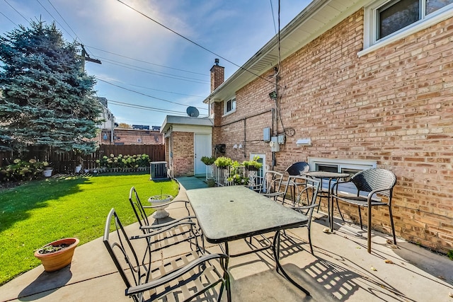 view of patio / terrace featuring outdoor dining space, central AC, and fence