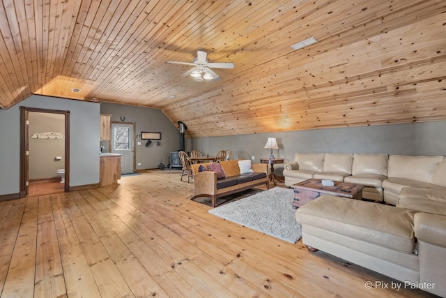 unfurnished living room with ceiling fan, wooden ceiling, light wood-type flooring, and vaulted ceiling