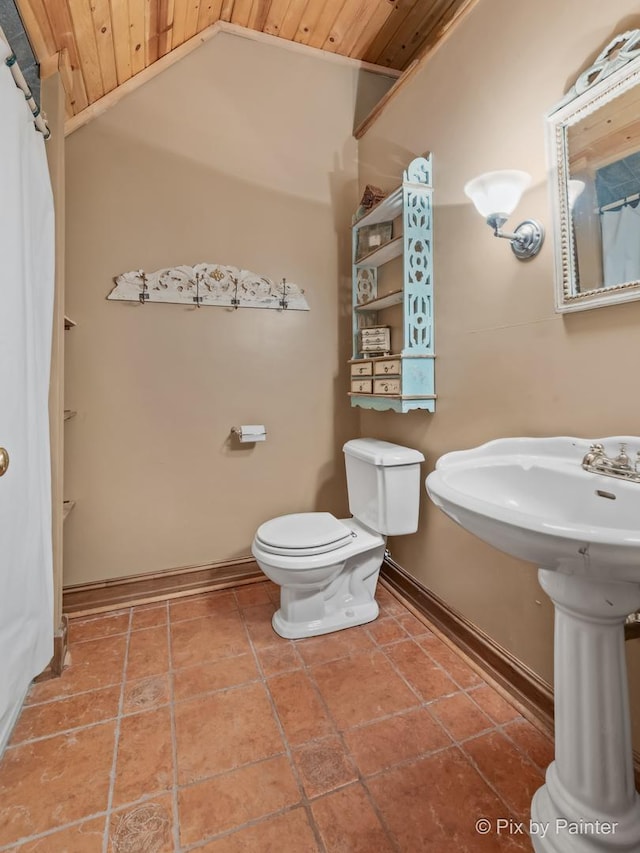 bathroom with tile patterned flooring, vaulted ceiling, toilet, and wood ceiling