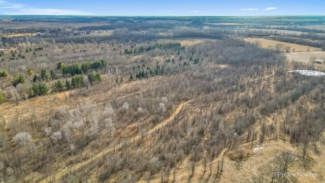 birds eye view of property with a rural view