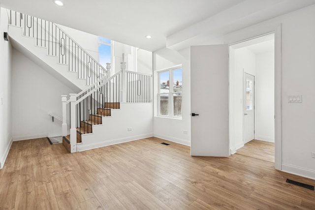 interior space with recessed lighting, visible vents, baseboards, and wood finished floors