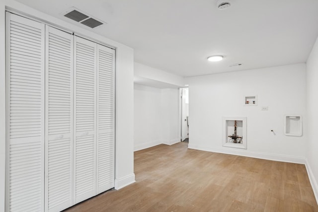 laundry area with washer hookup, visible vents, light wood-type flooring, laundry area, and baseboards