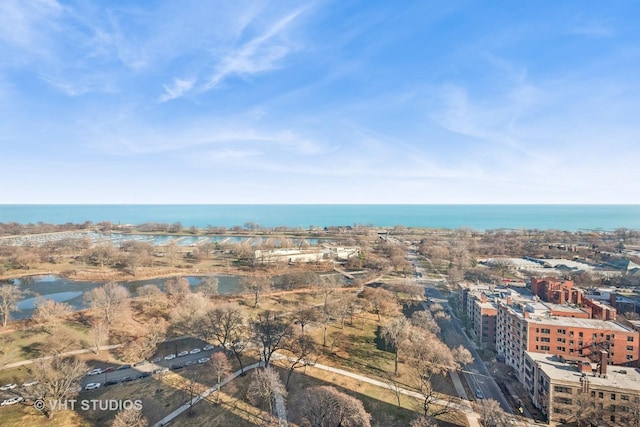 birds eye view of property featuring a water view