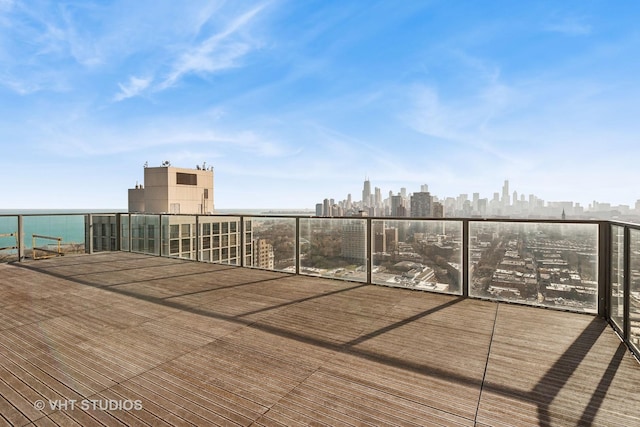 wooden terrace with a city view and a water view