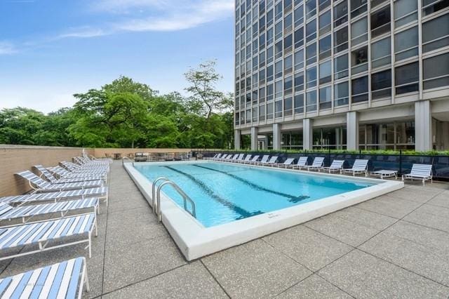 community pool featuring a patio area