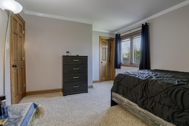 bedroom featuring ornamental molding, light carpet, and baseboards