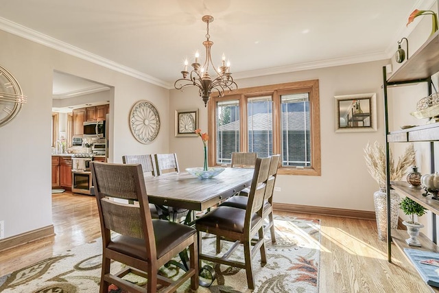 dining space with a chandelier, baseboards, light wood-type flooring, and crown molding