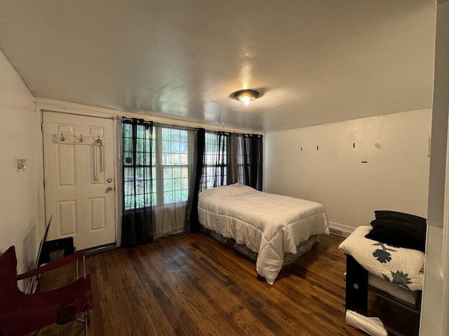 bedroom featuring dark wood-style floors