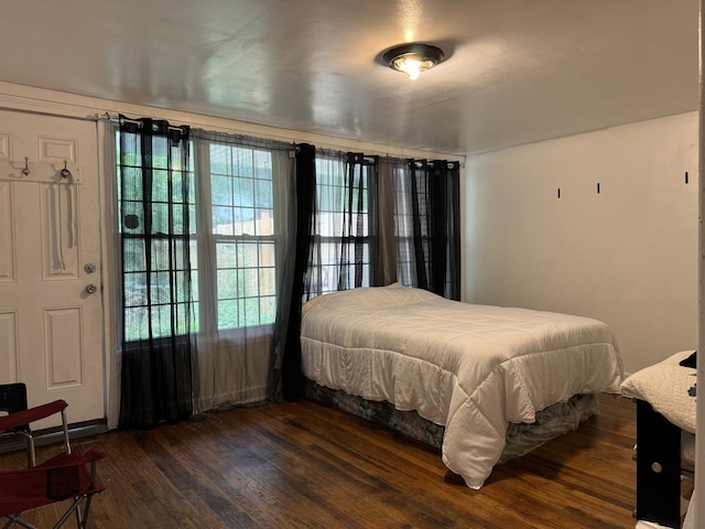 bedroom featuring dark wood-type flooring