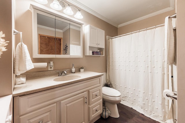 bathroom with vanity, a shower with curtain, wood finished floors, crown molding, and toilet