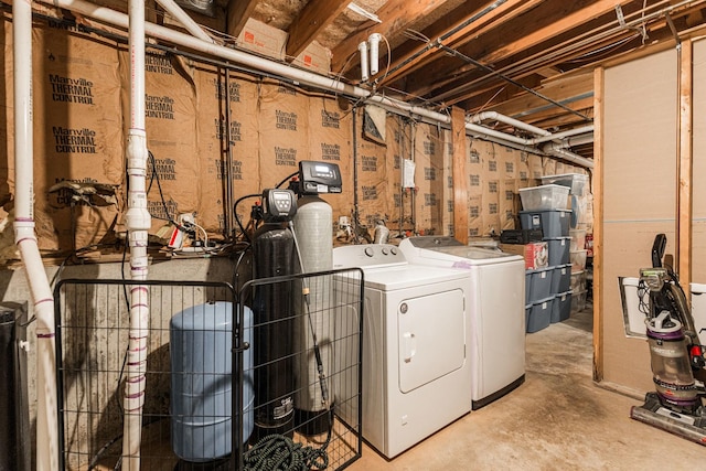 clothes washing area featuring laundry area and washing machine and dryer