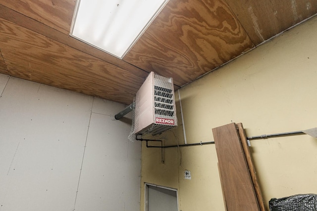 room details featuring a heating unit and wooden ceiling