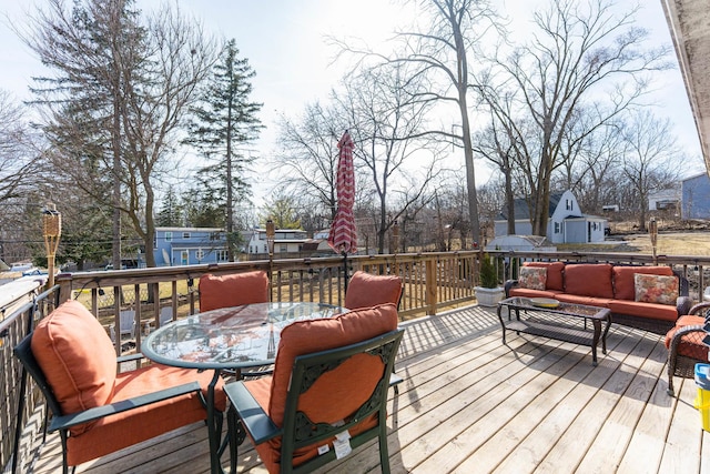 deck with outdoor lounge area and outdoor dining area