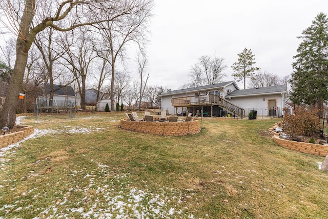 view of yard featuring stairs and a wooden deck