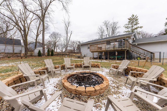 view of patio / terrace with an outdoor fire pit, stairway, and a wooden deck