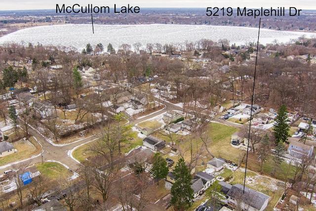 drone / aerial view with a residential view and a water view