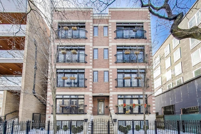 view of building exterior featuring fence